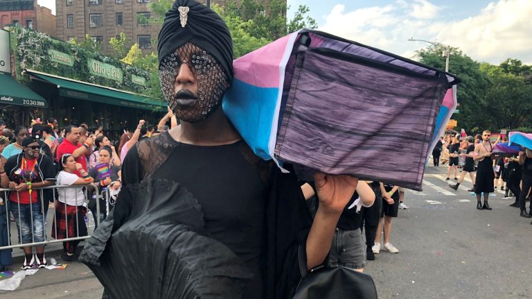 Laé D. Boi, with queer activists Voices 4, carries a coffin -- symbolizing members of the LGBTQ community that lost their lives due to hate crimes -- during the Pride March on Sunday.