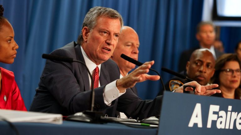 Mayor Bill de Blasio and Police Commissioner James O'Neill unveil a new policy to reduce marijuana arrests during a news conference  at the Thomas Jefferson Recreation Center in Manhattan on Tuesday. 