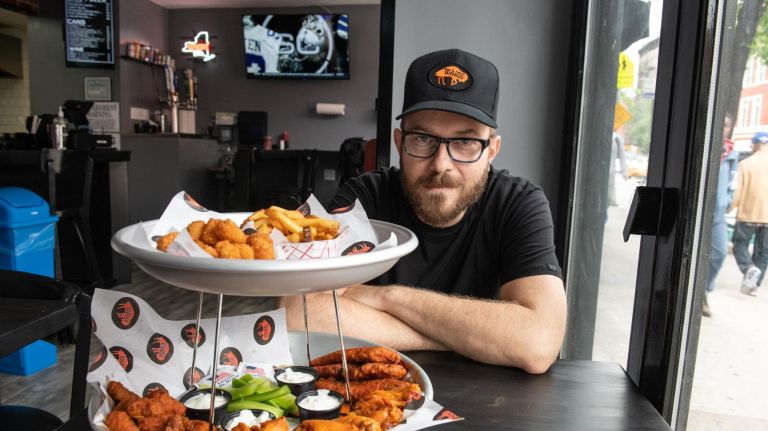 New York City's Buffalo wing spots, like John Henninger's takeout counter and new sports bar in the East Village (pictured), are seeing a rise in profile in NYC as self-proclaimed originator Anchor Bar opens its 11th franchise in Hell's Kitchen.