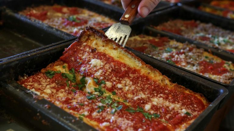Pizzas at Lions and Tigers and Squares are cooked in rectangular steel pans.