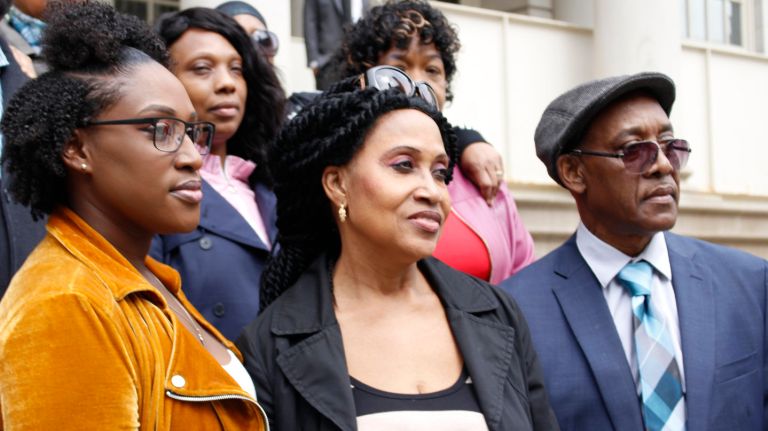 Shooting victim Saheed Vassell's family members, from left, Telah Vassell, Lorna Vassell  and Eric Vassell demand transparency from the NYPD at a rally on City Hall steps on Thursday.