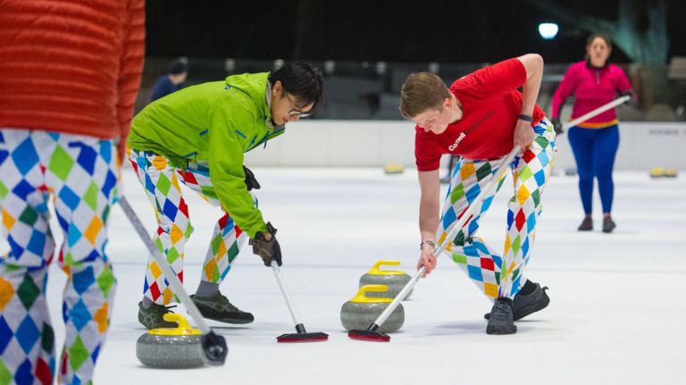 Curling in NYC growing in popularity 1 At Prospect Park's LeFrak Center at Lakeside, Derek Yi, 35 and Billy Gregg, 23, join in curling lessons.