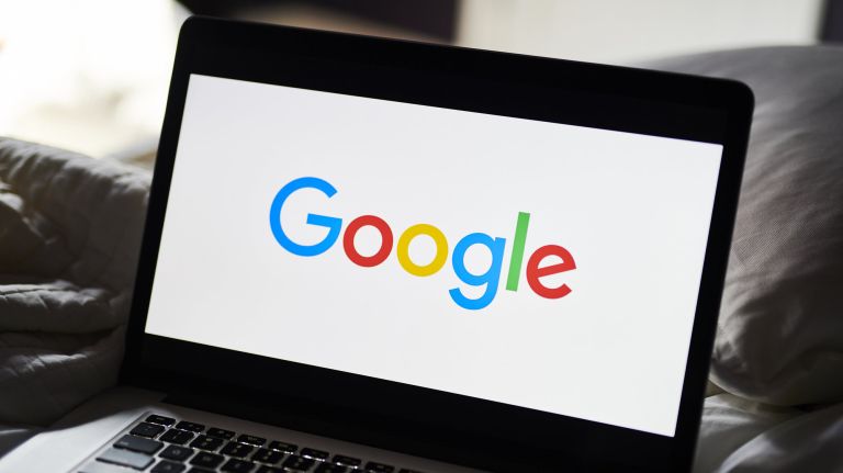 The Google Inc. logo is displayed on an Apple Inc. laptop computer in Little Falls, New Jersey on July 20, 2019.