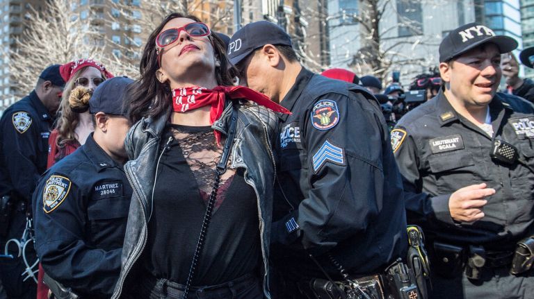 A woman is arrested in Manhattan's Columbus Circle during the A Day Without a Woman rally on March 8, 2017.