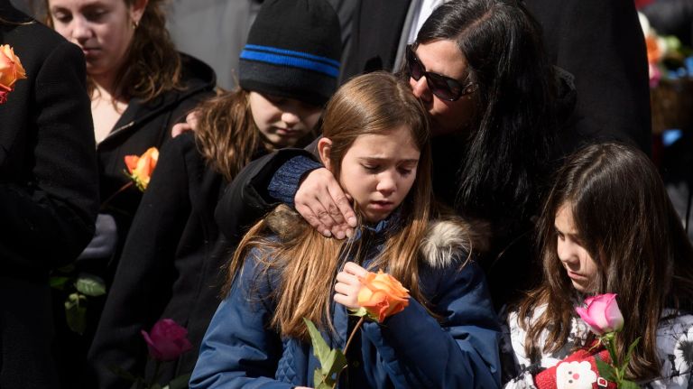 Loved ones of the six people killed during the 1993 World Trade Center bombing attend a memorial ceremony at the 9/11 Memorial & Museum's North reflecting pool on Sunday, Feb. 26, 2017.