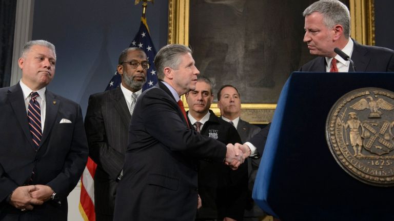 NYC, PBA reach contract agreement that includes body cameras 1 The Patrolmen's Benevolent Association and Mayor Bill de Blasio's office reached a contract agreement on Jan. 31, 2017, that includes the use of body cameras. Above, PBA President Patrick Lynch, center, and de Blasio, right, shake hands the contract agreement was announced on Jan. 31, 2017.