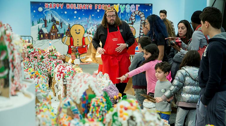 Gingerbread Lane, at New York Hall of Science, poised for Guinness record 1 Jon Lovitch, left, 40, the creator of the Guinness World Record busting Gingerbread Lane gives away pieces of his work to children in New York Hall of Science in Corona, Queens, on January 16, 2017.