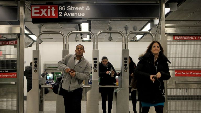 Commuters head into the Second Avenue subway's 86th Street station on Tuesday, Jan. 3, 2017, for the line's first rush hour commute.