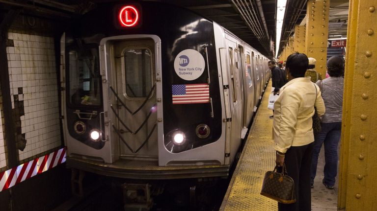 The L train shutdown offers a unique opportunity for the city to reimagine city streets, says the Riders Alliance and the Regional Plan Association  in a new report. Above, an L train at the 14th Street-Sixth Avenue station.
