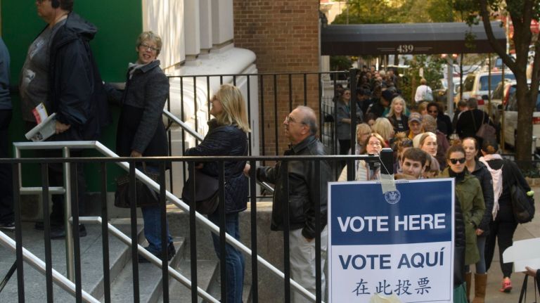 Voters wait in a long line on East 88th St.  to cast their ballots at Yorkville Community School in Manhattan on Nov. 8, 2016.