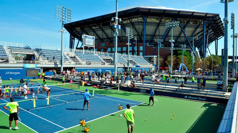 Police are searching for a man who they said tried to kidnap an 11-year-old girl at the U.S. Open Kids' Day event in Queens on Saturday, Aug. 27, 2016. Above, people attend the kids' day event at Arthur Ashe Stadium on Aug. 27, 2016.