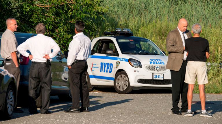 NYPD Commissioner Bill Bratton refuted claims that police were close to catching the killer in the case of slain Queens jogger Karina Vetrano on Aug. 18. 2016. Above, members of the NYPD investigate near a marshland area in Howard Beach, Queens, where Vetrano's body was found.

