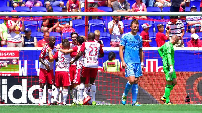 New York Red Bulls celebrate a first half goal by midfielder Sacha Kljestan (16) in an MLS game against the New York City FC at Red Bull Arena in Harrison, New Jersey on Sunday, July 24, 2016.
