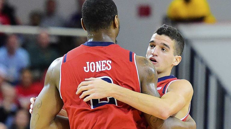 St. John's forward Christian Jones (2) congratulated by his teammate guard Federico Mussini (4) after dunking the ball against the Niagara at Carnesecca Arena in Queens, New York on Wednesday, Dec 9, 2015. NCAA Basketball between Niagara and St. John's.