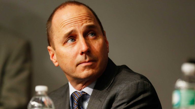 General Manager Brian Cashman looks on during Carlos Beltran's introductory press conference at Yankee Stadium on Dec. 20, 2013 in the Bronx.