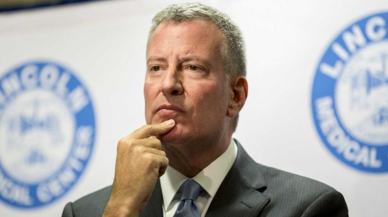 De Blasio's tone on criminal justice taking a turn 1 Mayor Bill de Blasio listens to a reporter's question at Lincoln Hospital in the Bronx on Aug. 4, 2015.