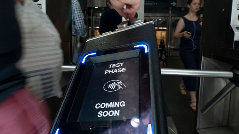 OMNY, pictured above at a Manhattan subway station, will be adopted across the PATH system by the end of 2022.