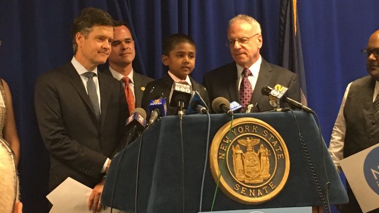 A fight to end religious exemptions for vaccinations in NY state becomes a race 1 King Singh, 5, speaks at a news conference Tuesday with his father, Michael Singh, left, making the case for a bill that would end religious exemptions for vaccinations in New York state.