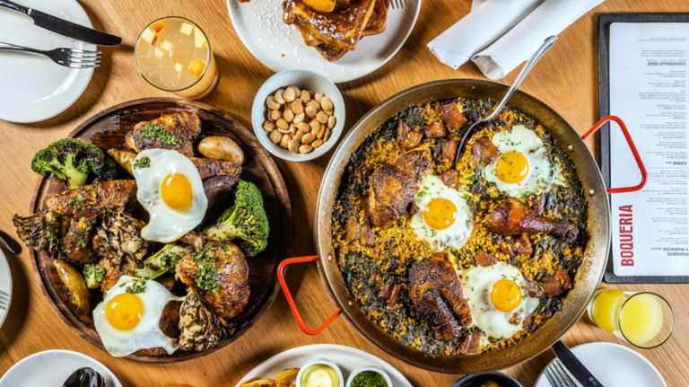 Boqueria spices up its remix of paella with pork belly, slow roasted chicken, sweet piquillo peppers and poached eggs. 