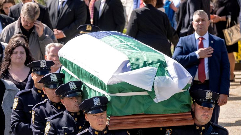 The casket holding NYPD officer Brian Mulkeen is carried from the Sacred Heart in Monroe, N.Y. on&nbsp;Oct. 4, 2019.&nbsp;Mulkeen, 33, was killed in a friendly fire incident as he wrestled with a suspect running from he and his fellow officers in the Bronx last week.