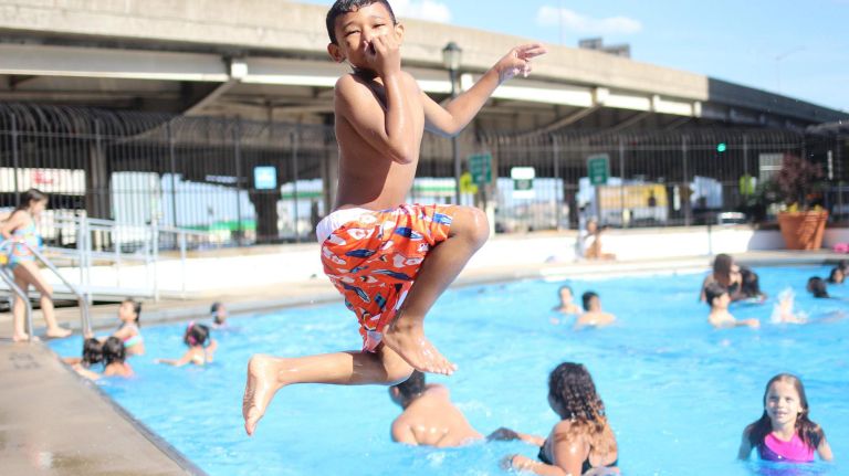 13 of NYC's best public pools: Cool off in all five boroughs 14 At 120 feet long, the pool at the Asser Levy Rec Center offers a lot of space to stretch out and get your laps in -- if you get there early. It's typically a clean pool with warm water and on hot days, it can become a bit crowded. The Rec Center also has an indoor pool that you can take advantage of as well. Pictured, Jayden Martinez, 7, of Brooklyn, jumps into the pool. (390 Asser Levy Pl.)