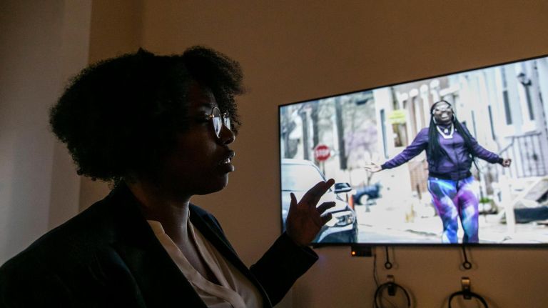 Ex-prisoners speak their truths through art in the 'O.G. Experience' 4 Mary Enoch Elizabeth Baxter, a multimedia artist, filmmaker, producer, writer in front of her film, "Ain't I a Woman" at the opening reception of The O.G. Experience.