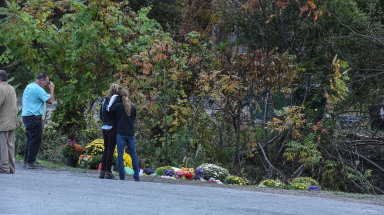 On Monday, people mourn at the site of the fatal limousine crash in Schoharie, New York. 