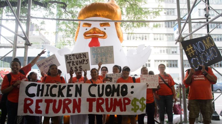 Protesters outside Gov. Andrew Cuomo's Manhattan office on Monday demanded he return $64,000 in campaign contributions from Donald Trump.