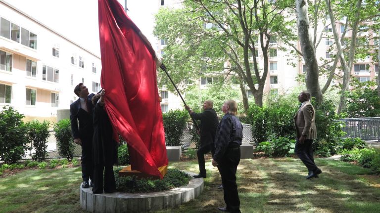 Roosevelt Island officials and artists unveil a plinth and a sculpture by Michael Poast as part of their effort to create an art trail.