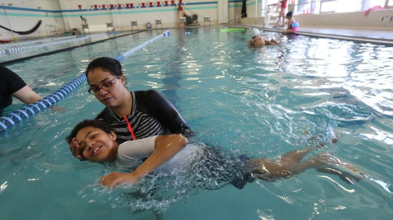 Bronx mom, YMCA teach adaptive swimming classes for children on autism spectrum 1 Rima Izquierdo and her son, Darius, 11, participate in an adaptive swimming class at the Bronx YMCA.