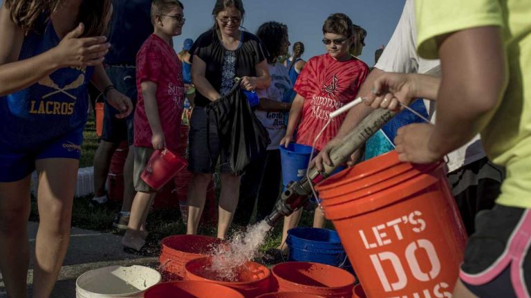 The Ice Bucket Challenge, above in 2014, raised millions for ALS research. Now supporters are raising money by eating hot peppers.