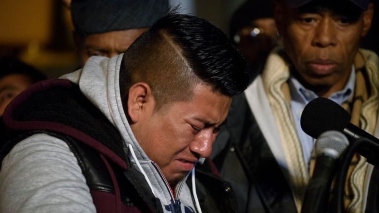 Edwin Ajacalon was killed when he was hit by a driver in Brooklyn on Saturday, Nov. 25, 2017. Above, Eduardo Vicente, Ajacalon's uncle, cries during a vigil for the boy.