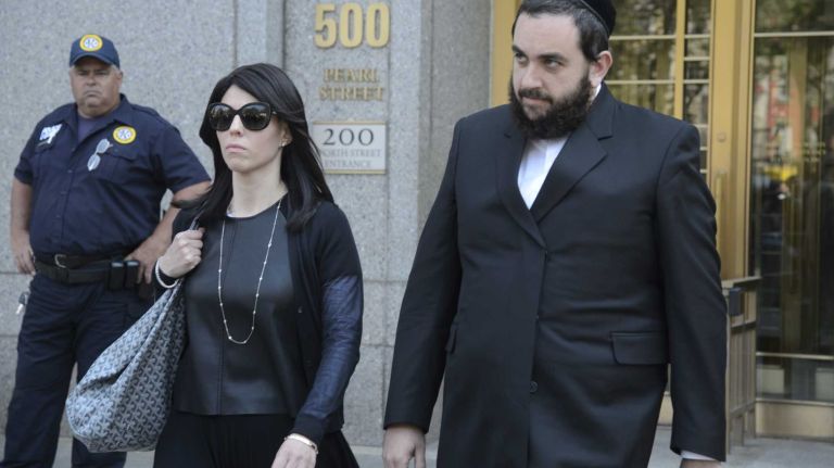 Jeremy Reichberg, right, exits a federal courthouse in Manhattan after being arraigned on Monday, June 20, 2016.  Reichberg was charged with bribing NYPD officials.