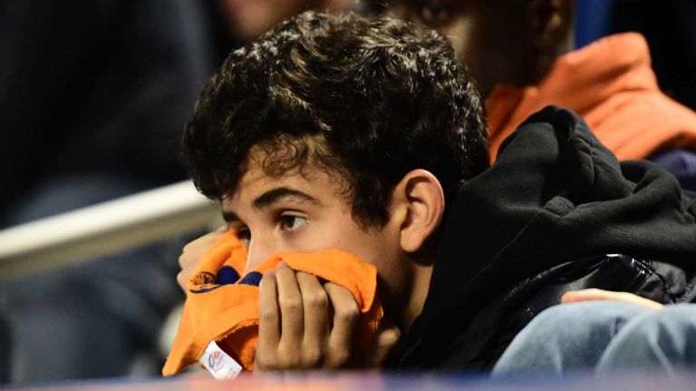 New York Mets fans are reacting in the twelfth inning during Game 5 of the World Series against the Kansas City Royals at Citi Field on Sunday, Nov. 1, 2015.
