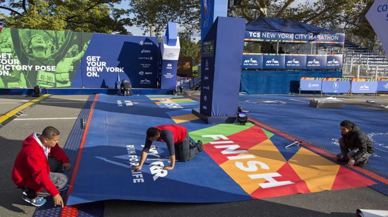 Preparations are made at the finish line for the 2014 TCS New York City Marathon Thursday, Oct. 30, 2014.