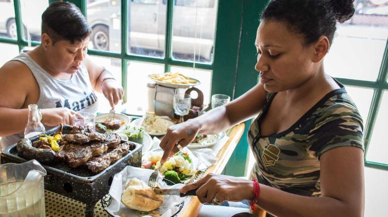 NYC's best foodie neighborhoods: Jackson Heights, Carroll Gardens and more 1 Yarisney Larreal and Keyla Aguilar dine at El Chivito D'oro in Jackson Heights on August 8, 2014.