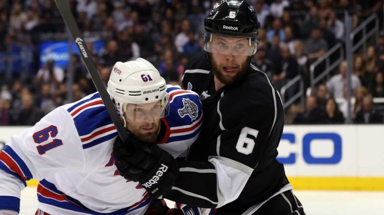 Rick Nash collides with Jake Muzzin during Game 1 of the 2014 NHL Stanley Cup Final at the Staples Center on June 4, 2014.