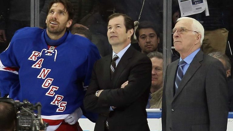 Henrik Lundqvist #30 of the New York Rangers is joined former Rangers Mike Richter (C) and Ed Giacomin (R) as the Rangers honor him prior to the game against the Phoenix Coyotes at Madison Square Garden on March 24, 2014.