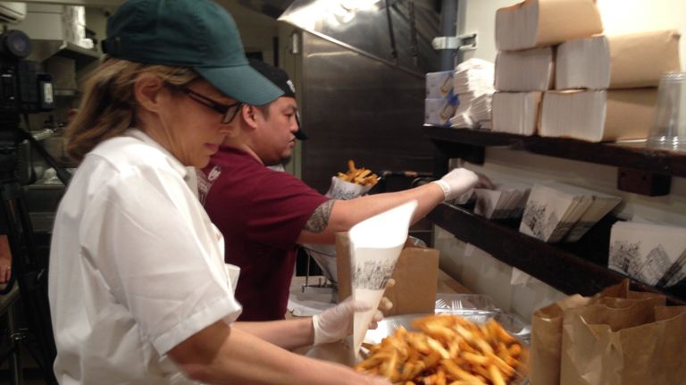 Pommes Frites co-owner Suzanne Levinson cooks up a batch of her store's famous fries. 