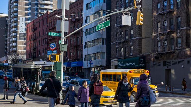 NYC traffic deaths at historic low, but city says there's more to do 1
Pedestrians pass along crosswalks at W. 96th and Broadway Tuesday, Jan. 19, 2016, an intersection that was changed as part of the Vision Zero programs to reduce pedestrian deaths but changing traffic patterns.