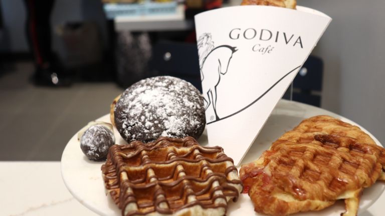 The caf&eacute; includes GODIVA favorites such as chocolate-dipped strawberries and Chocolixir --&nbsp;the signature&nbsp;frozen chocolate drink --&nbsp;as well as Belgian liege waffles,&nbsp;