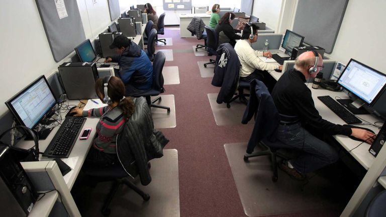 Job hunters use computers on March 21, 2014, to search for jobs at the Suffolk County One-Stop Employment Center in Hauppauge.