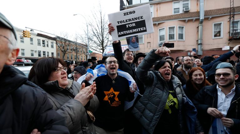 Councilman in anti-Palestine tweet flap could be removed from immigration committee 4 Supporters of Councilman Kalman Yeger shout at pro-Palestine demonstrators outside his Brooklyn office on Thursday.