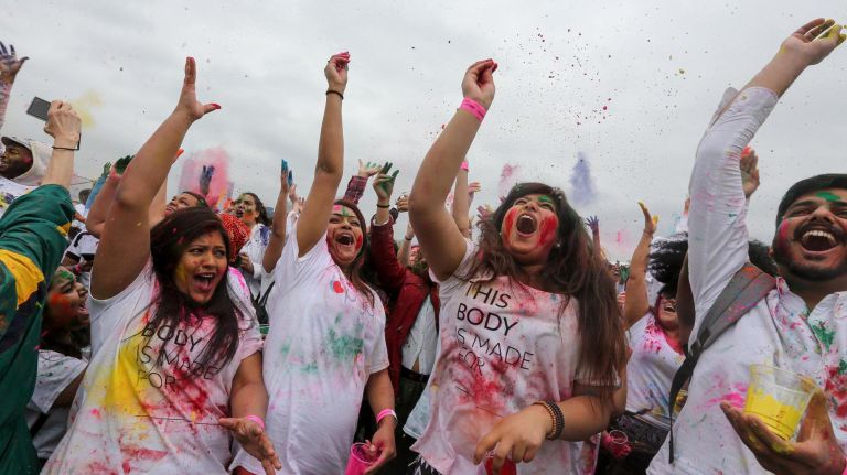 How to celebrate Holi 2019 in NYC, from colorful parties to festivals 1 Revelers at the Holi Hai Festival on Governors Island throw colored powder in the air and on one another celebrating the arrival of spring in 2018.