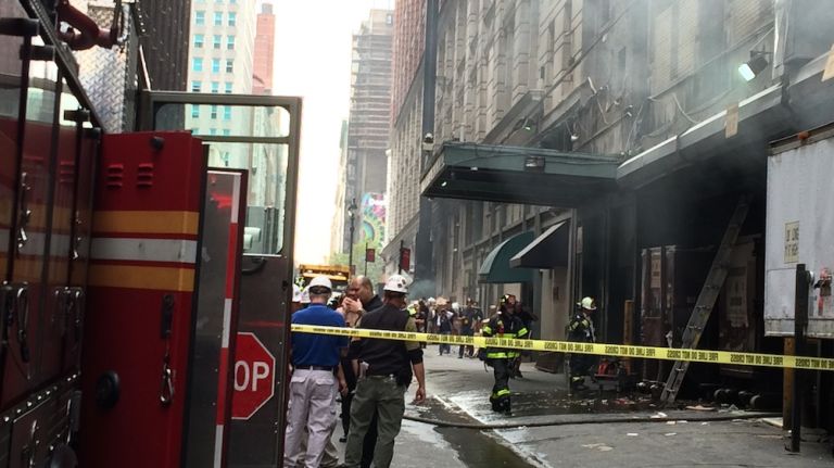 Macy's fire fills 35th Street with smoke 1 A fire broke out in one of the dumpster of the loading dock at Macy's on October 10, 2014.