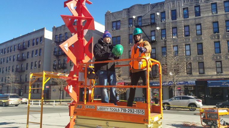 Free fair celebrates 40 years of youth empowerment in East Harlem 3 Instructor Ron Castro, left, and student Sean Washington at the installation site for the South Bronx Pride Totem, designed by local artist Roy Secord and built by the 2018-19 Youth Action YouthBuild cohort in January.