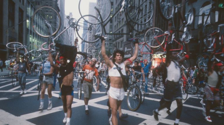 Steve Athineos (center, in white) leads a bike messenger protest in a 1987&nbsp;image on display at "Cycling in the City" at the Museum of the City of New York.