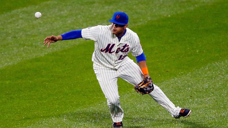 uan Lagares #12 of the New York Mets bobbles the ball in centerfield for a sixth inning error against the Washington Nationals at Citi Field on September 13, 2014.