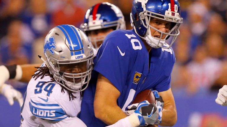 Eli Manning was sacked three times by the Lions' Ziggy Ansah on Monday.