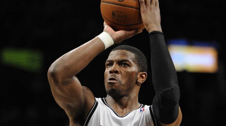 Brooklyn Nets guard Joe Johnson shoots a free throw against the Orlando Magic in the first half of an NBA basketball game at Barclays Center on Sunday, April 13, 2014.